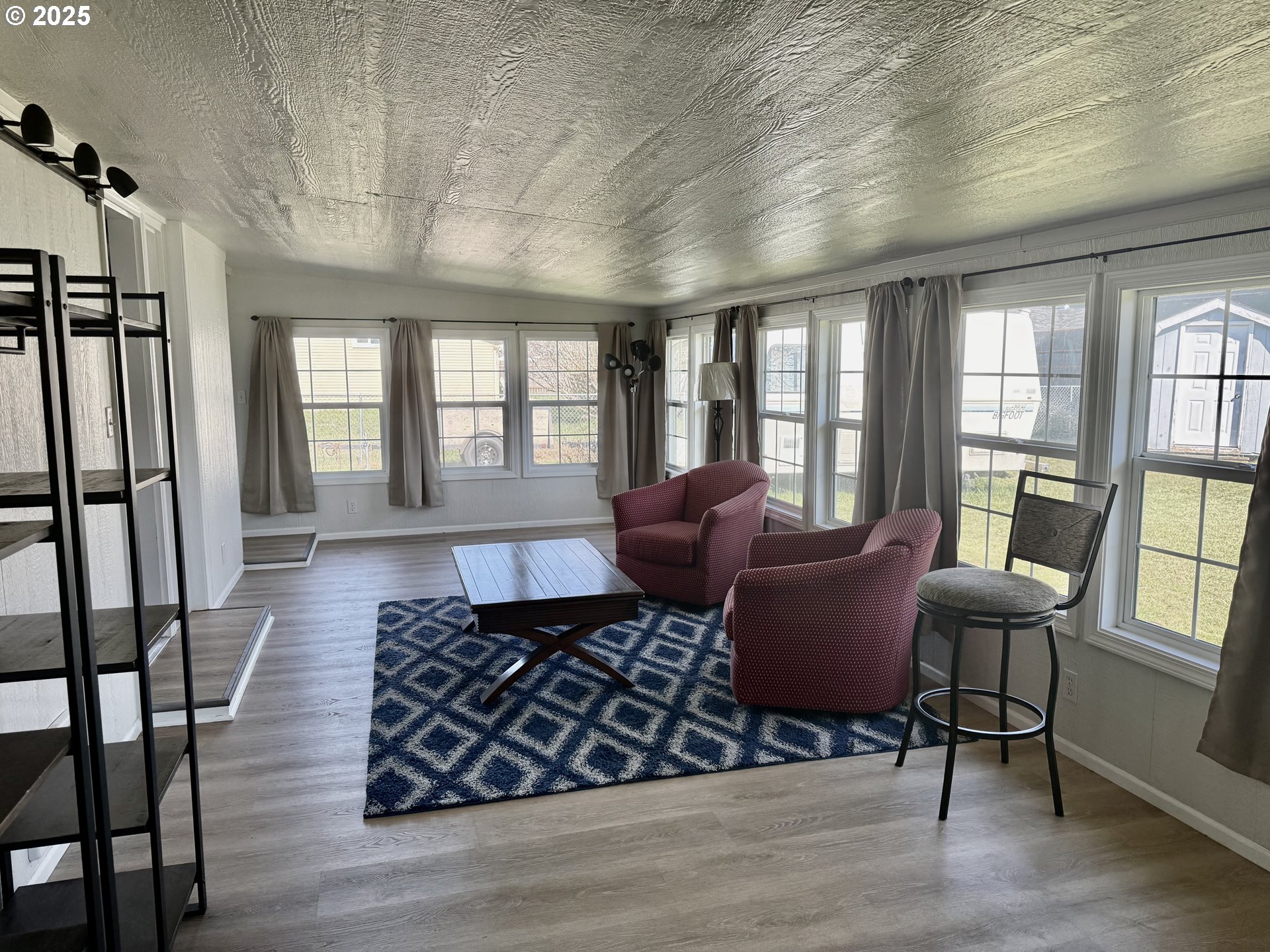 345 38th Street Springfield, OR 97478 - Photo 21 of 29 a living room with furniture and a large window