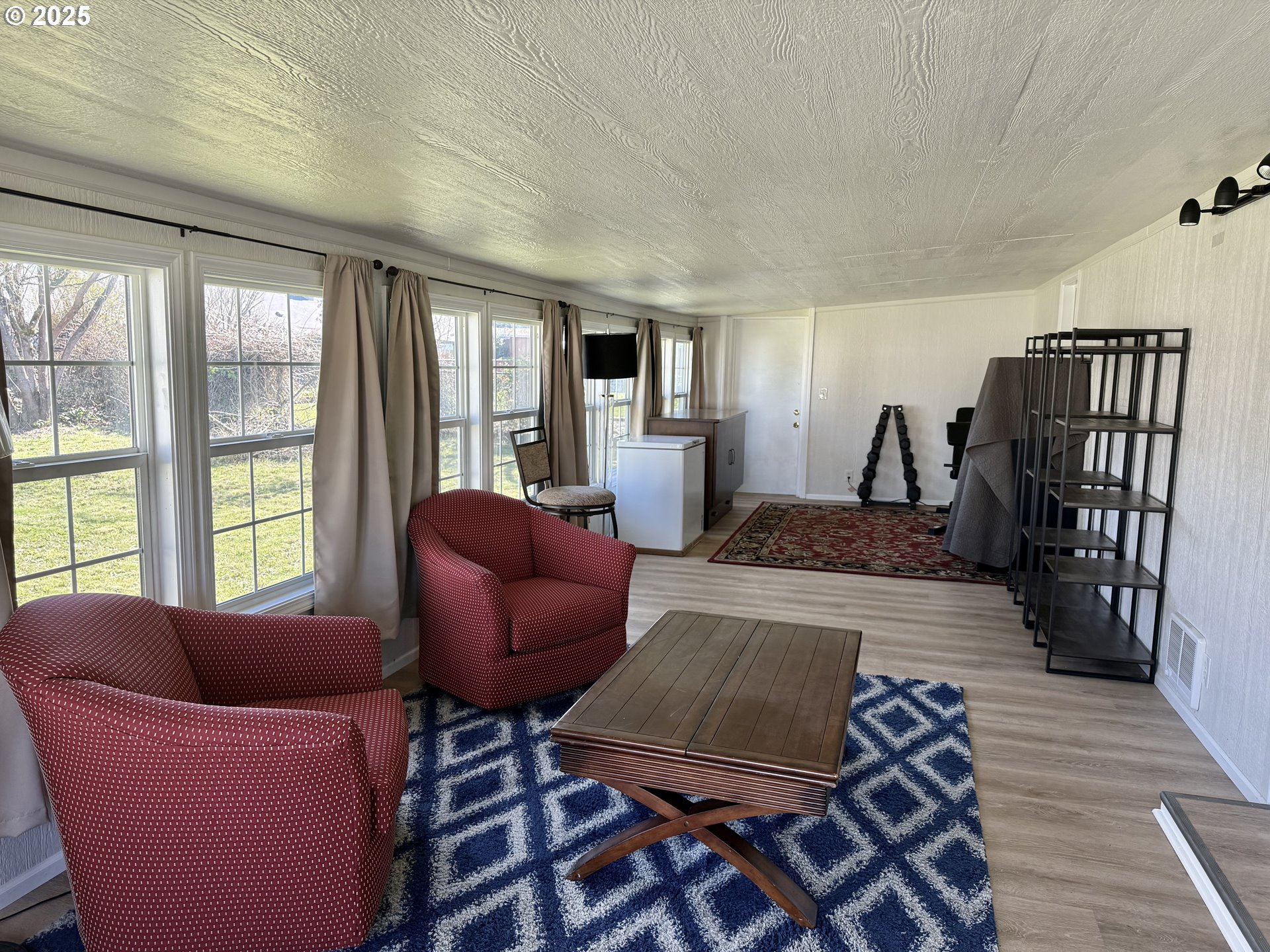 345 38th Street Springfield, OR 97478 - Photo 22 of 29 a living room with furniture and a rug