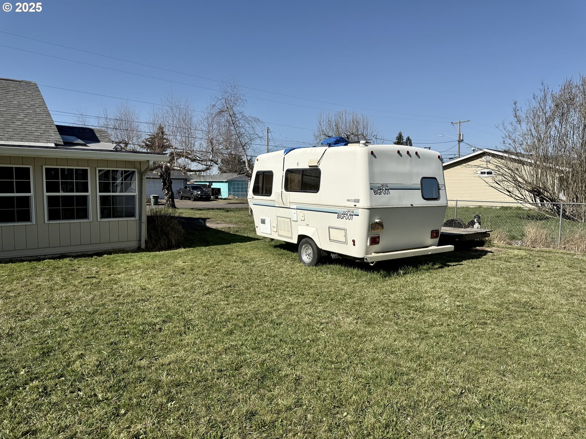 345 38th Street Springfield, OR 97478 - Photo 29 of 29 a white house sitting in middle of the middle of a field