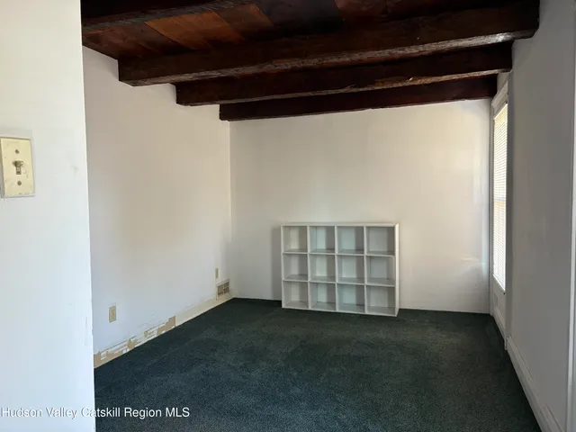 a view of an empty room with a fireplace