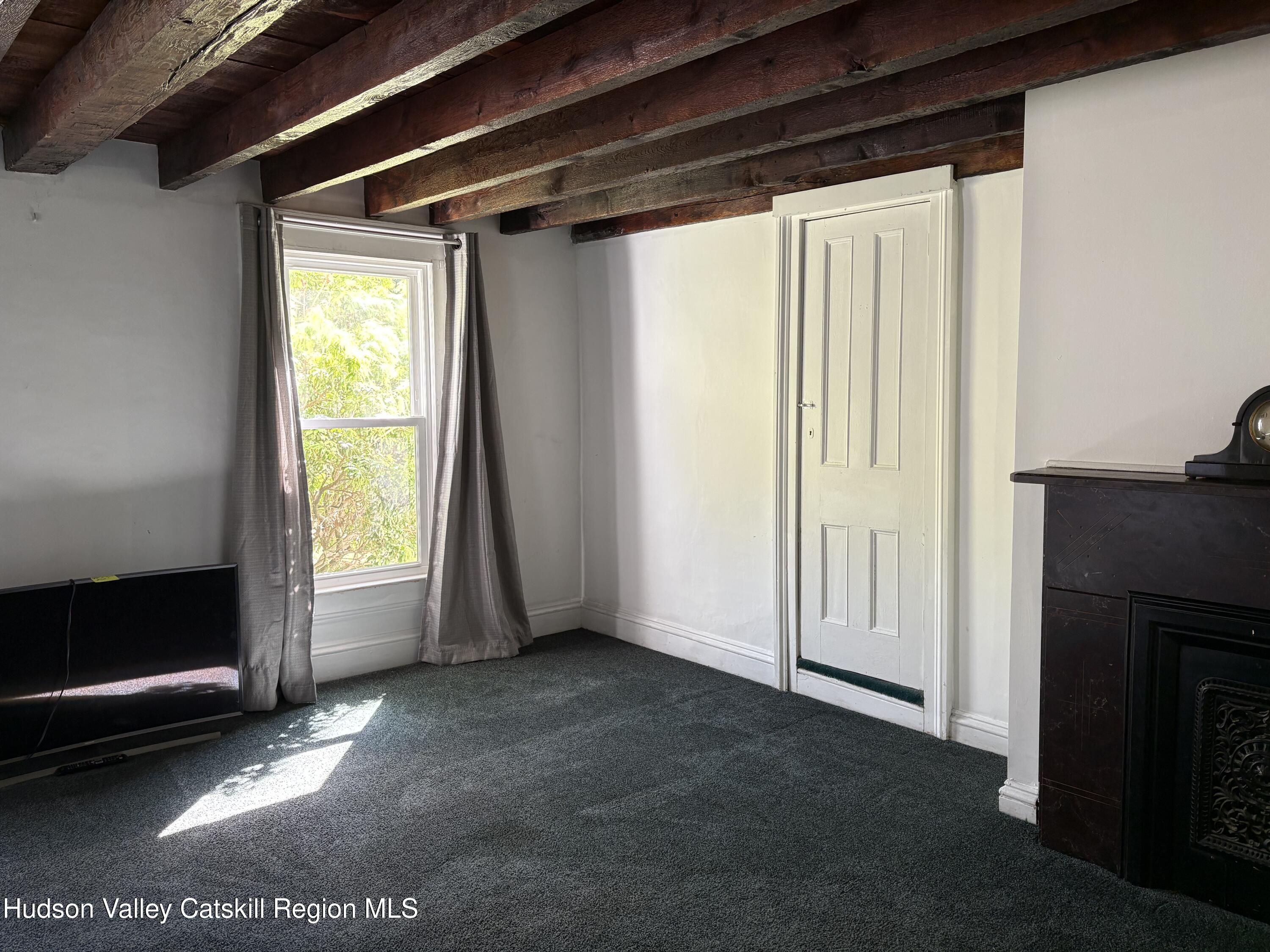 42 Maple Avenue, Unit 2 Highland, NY 12528 - Photo 7 of 11 a view of empty room with floor to ceiling window