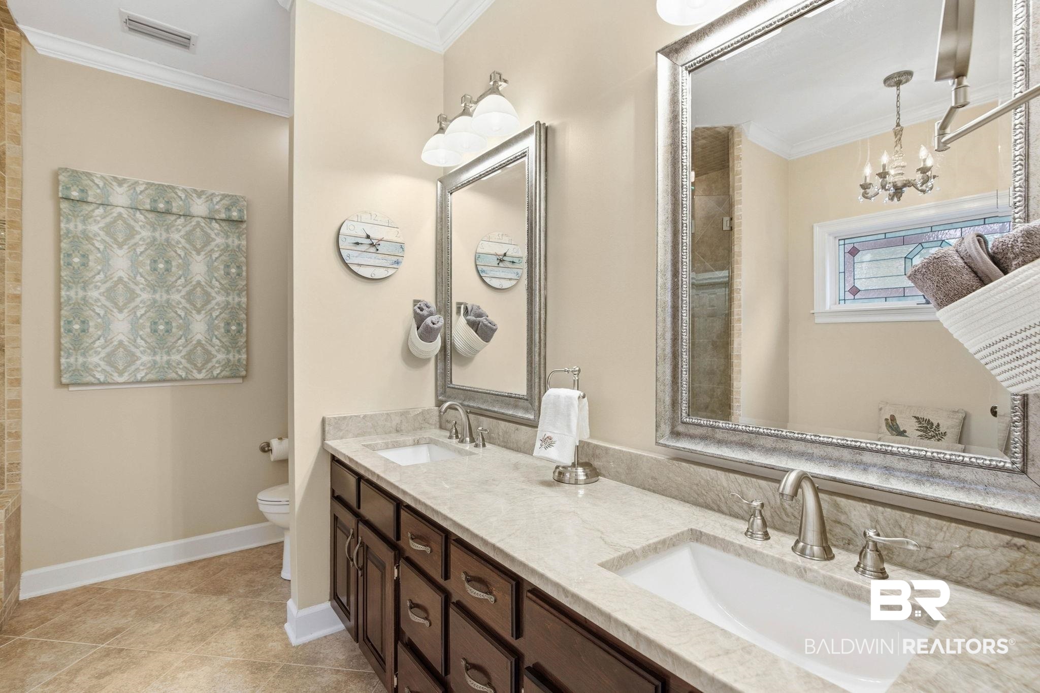 31515 Rhett Drive Spanish Fort, AL 36527 - Photo 36 of 100 The Primary Bathrooms has a custom tiled shower and a double vanity with quartz countertops