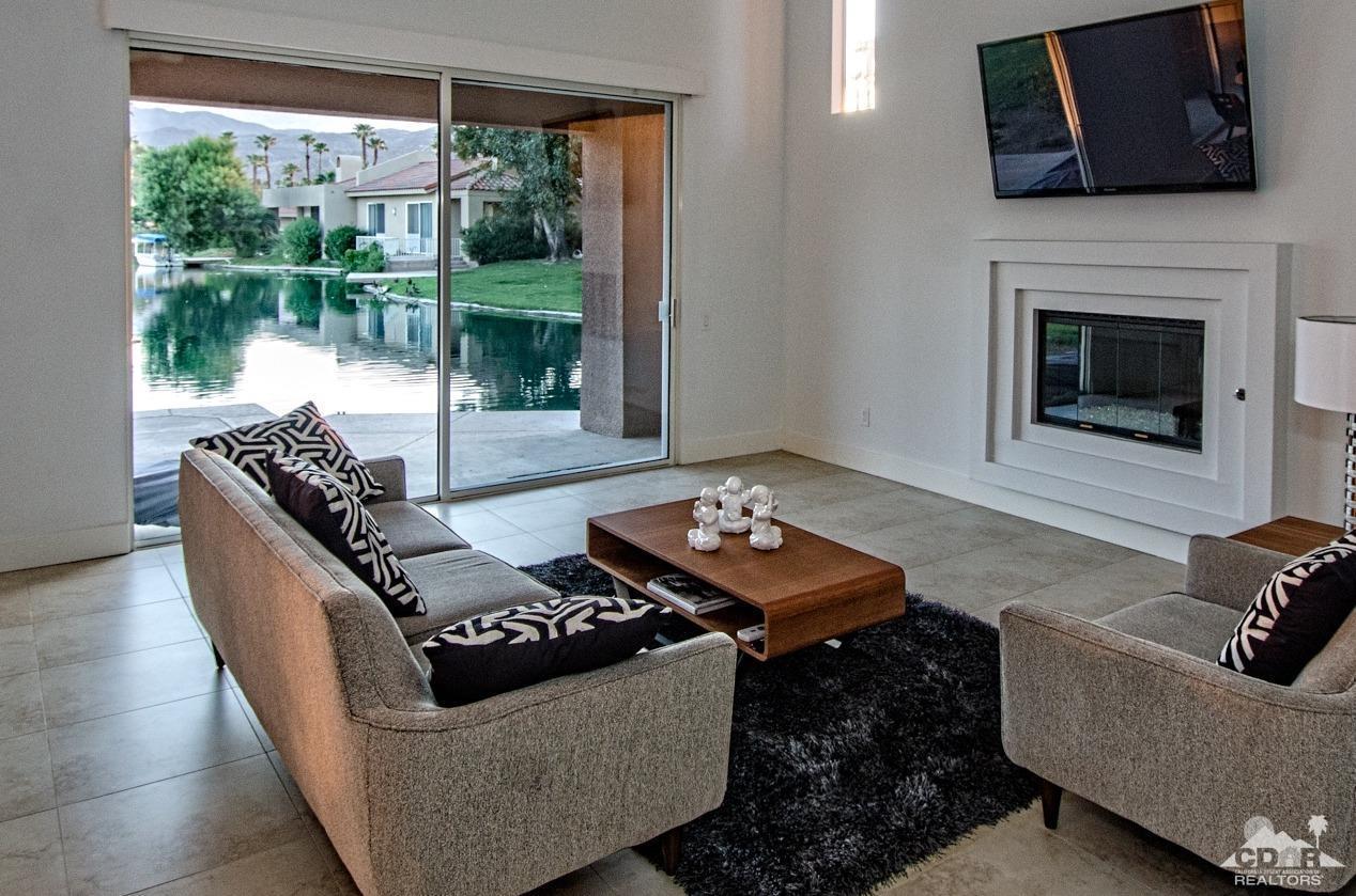 125 Lakeshore Drive Rancho Mirage, CA 92270 - Photo 12 of 79 a living room with furniture and a fireplace