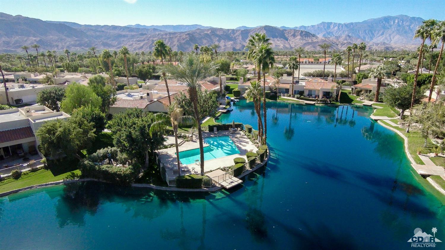 125 Lakeshore Drive Rancho Mirage, CA 92270 - Photo 14 of 79 a view of a house with a garden and a mountain view