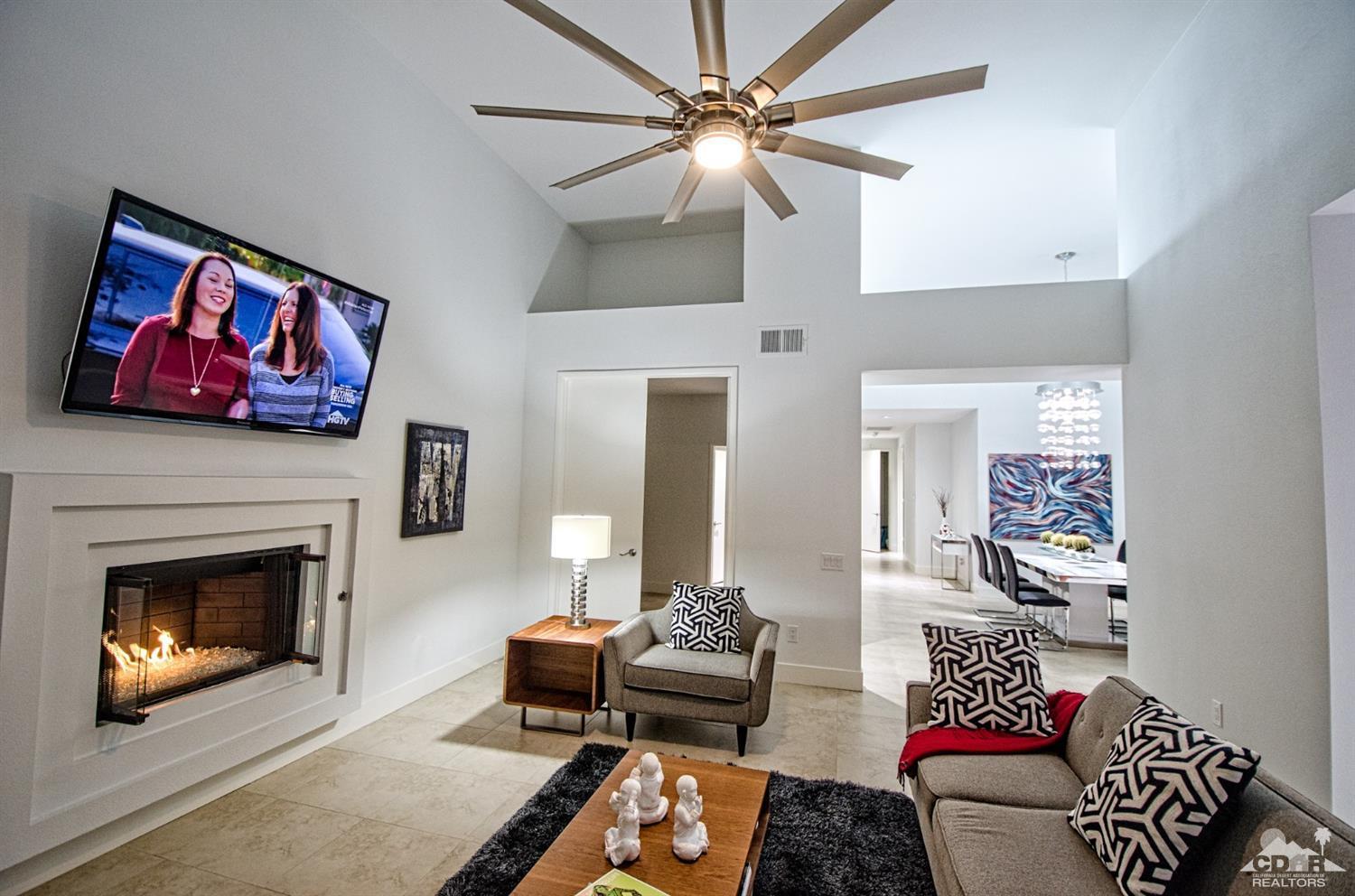 125 Lakeshore Drive Rancho Mirage, CA 92270 - Photo 18 of 79 a living room with furniture and a fireplace