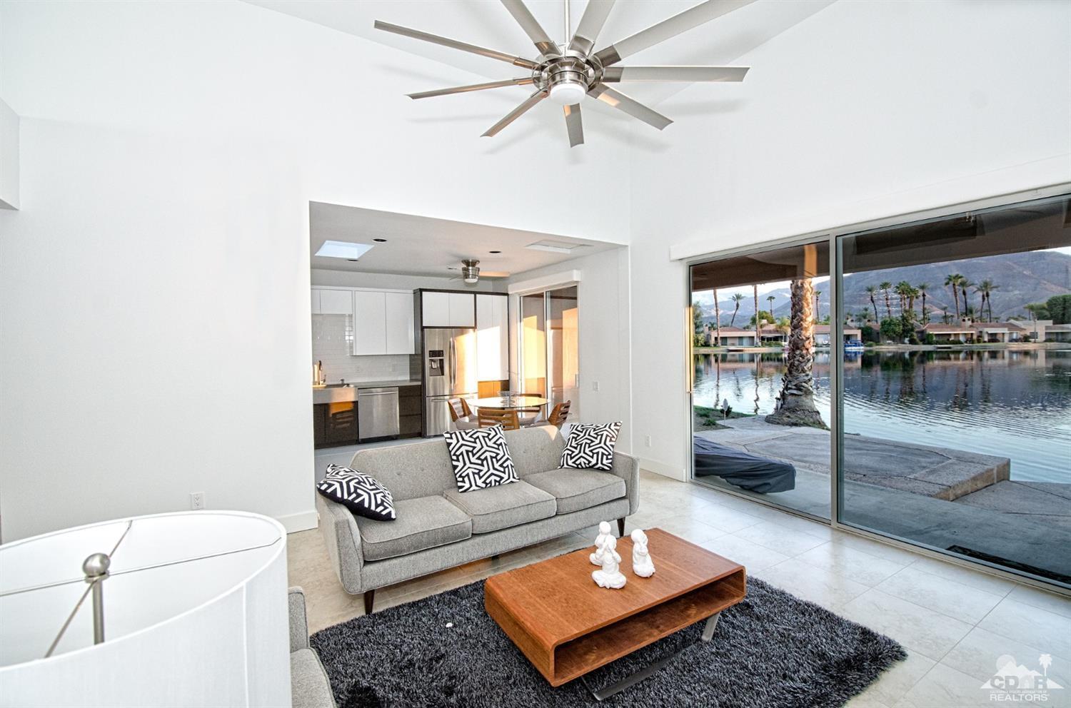 125 Lakeshore Drive Rancho Mirage, CA 92270 - Photo 3 of 79 a living room with furniture and a table