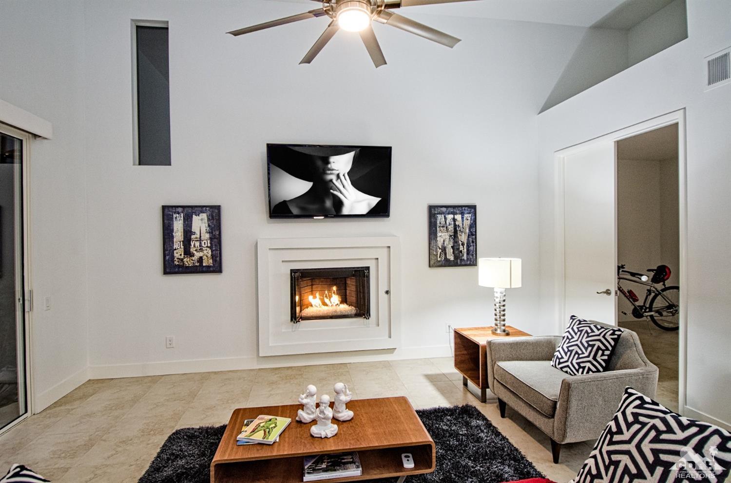 125 Lakeshore Drive Rancho Mirage, CA 92270 - Photo 21 of 79 a living room with furniture and a fireplace
