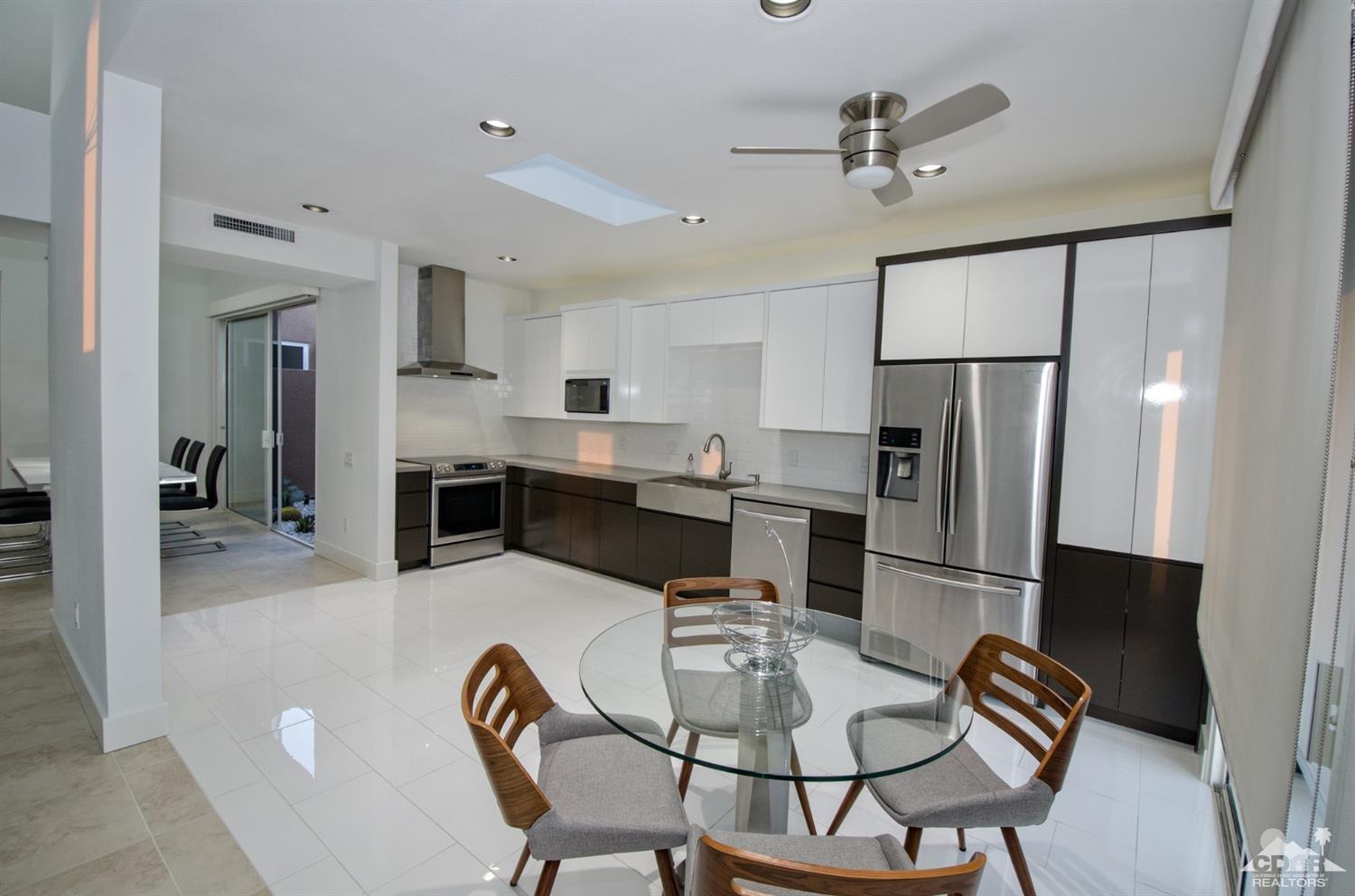 125 Lakeshore Drive Rancho Mirage, CA 92270 - Photo 32 of 79 a view of kitchen with stainless steel appliances refrigerator dining table and chairs