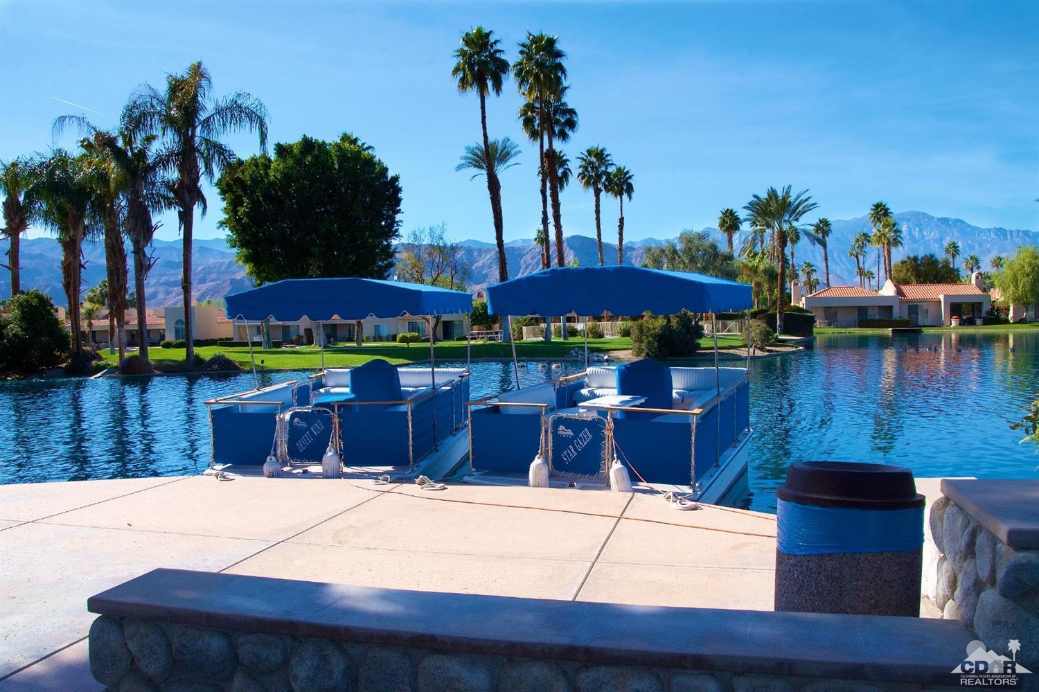 125 Lakeshore Drive Rancho Mirage, CA 92270 - Photo 36 of 79 a swimming pool with outdoor seating and yard