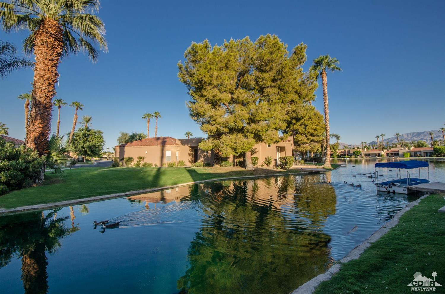 125 Lakeshore Drive Rancho Mirage, CA 92270 - Photo 39 of 79 a view of a lake with a bridge