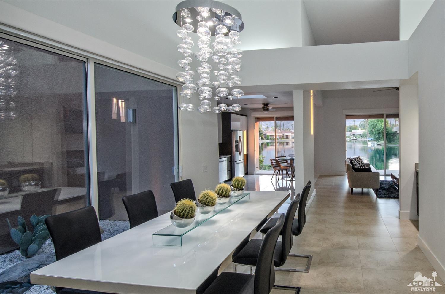125 Lakeshore Drive Rancho Mirage, CA 92270 - Photo 5 of 79 a view of a dining room with furniture window and wooden floor