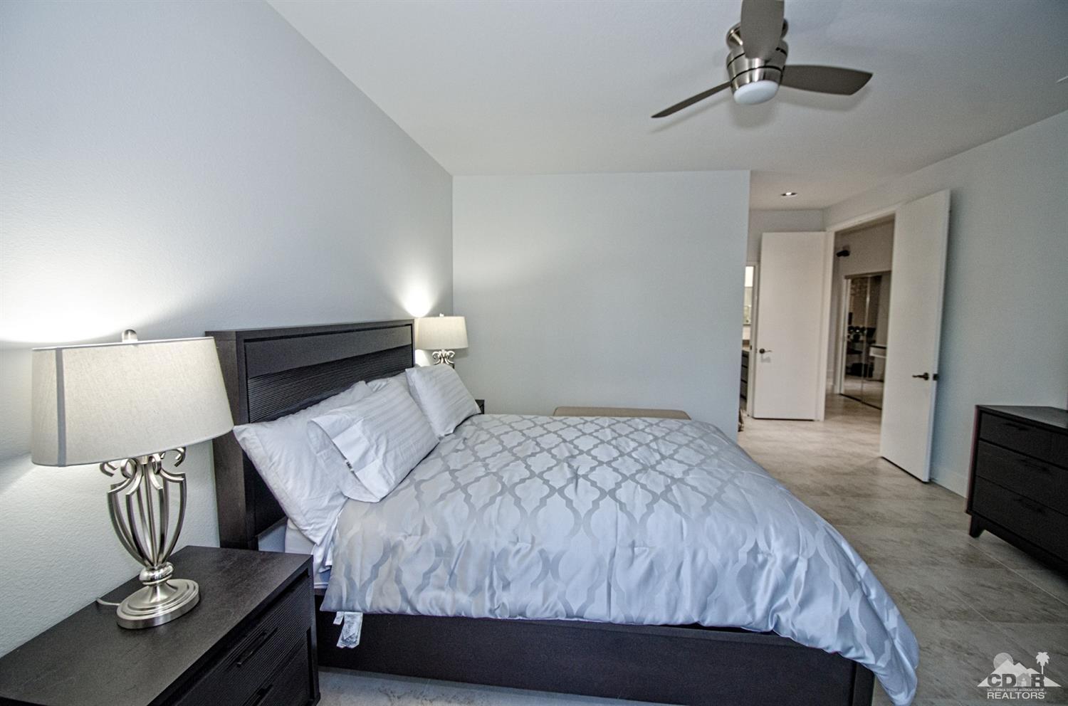 125 Lakeshore Drive Rancho Mirage, CA 92270 - Photo 45 of 79 a bedroom with a bed and dresser