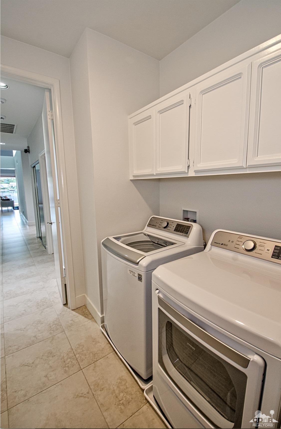 125 Lakeshore Drive Rancho Mirage, CA 92270 - Photo 50 of 79 a utility room with dryer and washer