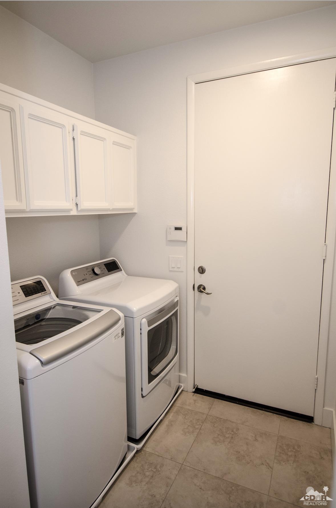 125 Lakeshore Drive Rancho Mirage, CA 92270 - Photo 52 of 79 a utility room with dryer and washer