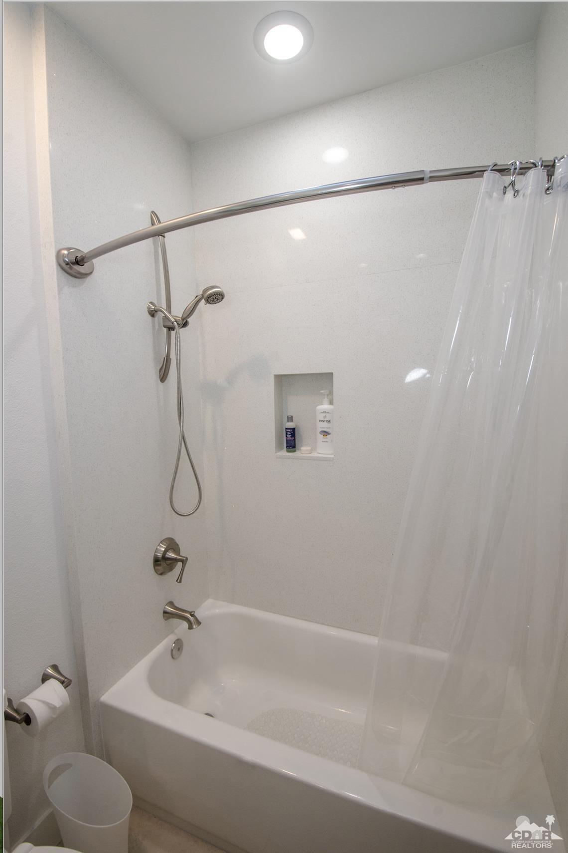 125 Lakeshore Drive Rancho Mirage, CA 92270 - Photo 54 of 79 a bathroom with a shower and a toilet sink