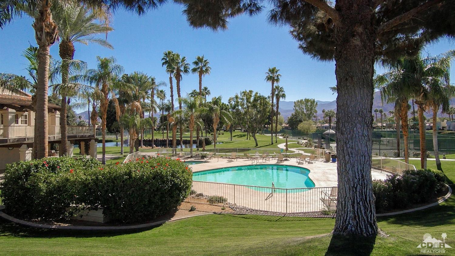 125 Lakeshore Drive Rancho Mirage, CA 92270 - Photo 58 of 79 a view of a swimming pool with a garden