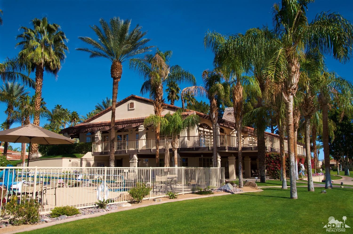 125 Lakeshore Drive Rancho Mirage, CA 92270 - Photo 67 of 79 a front view of a house with garden and sitting area