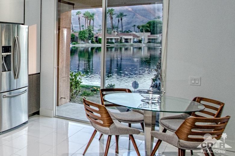 125 Lakeshore Drive Rancho Mirage, CA 92270 - Photo 8 of 79 a dining room with a table and chairs