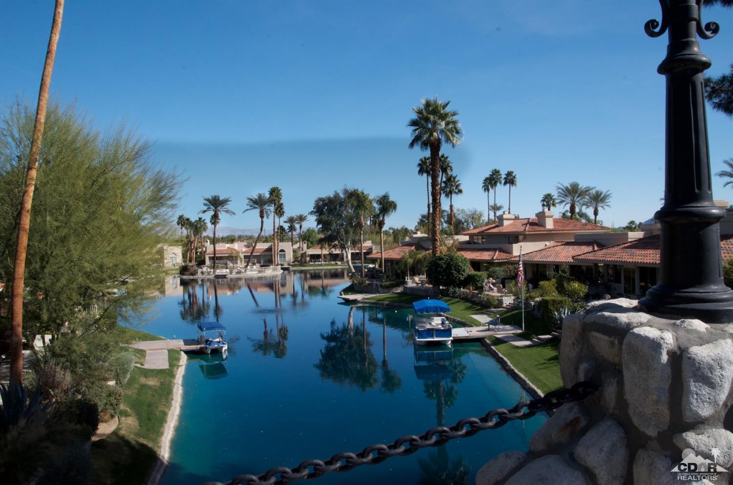 125 Lakeshore Drive Rancho Mirage, CA 92270 - Photo 71 of 79 a view of a swimming pool with outdoor seating and plants