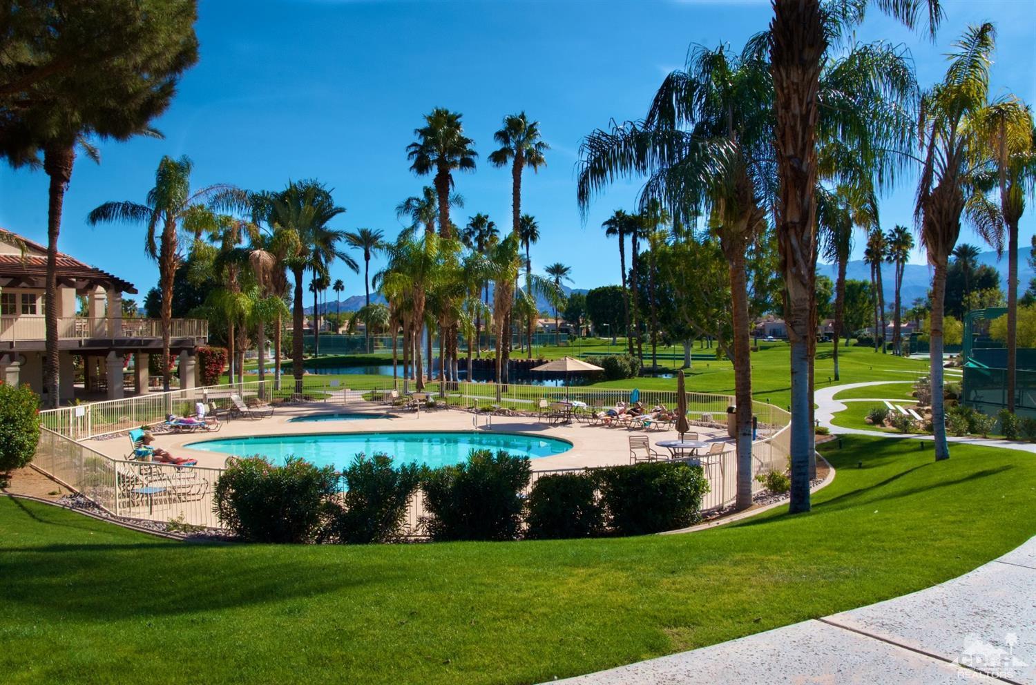 125 Lakeshore Drive Rancho Mirage, CA 92270 - Photo 75 of 79 a view of a swimming pool with a garden and plants