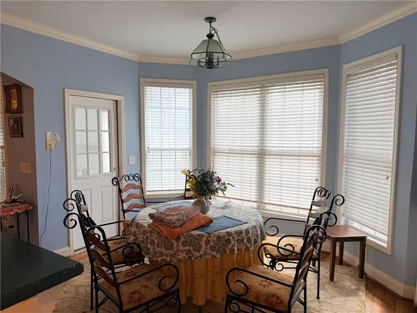 a view of a dining room with furniture window and outside view