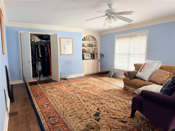a bedroom with furniture and a window