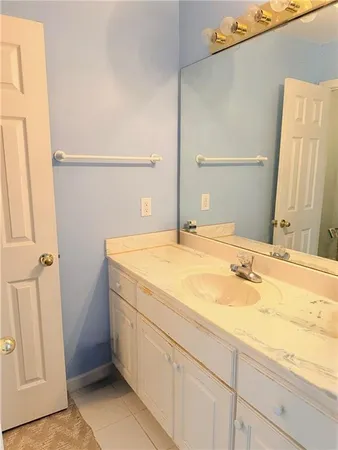 a bathroom with a sink and a mirror