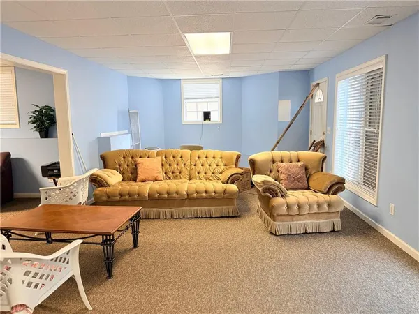 a living room with furniture and a couch
