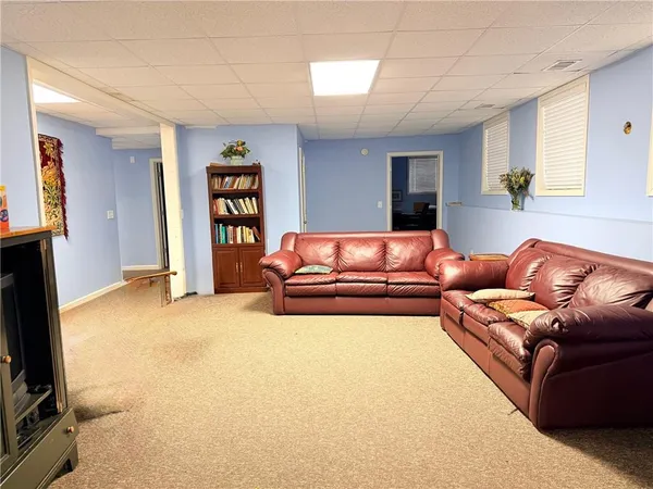 a living room with a couch and a flat screen tv