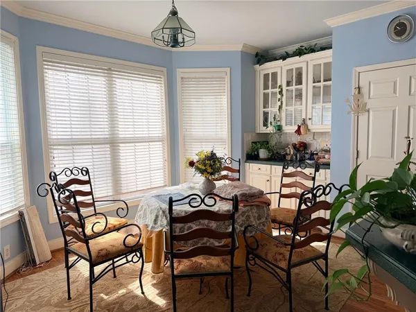a view of a dining room with furniture window and outside view