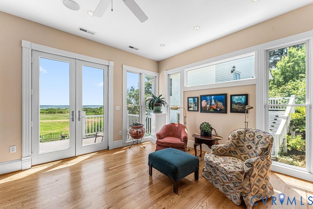 2414 Windmill Point Road White Stone, VA 22578 - Photo 25 of 72 a living room with furniture and a large window