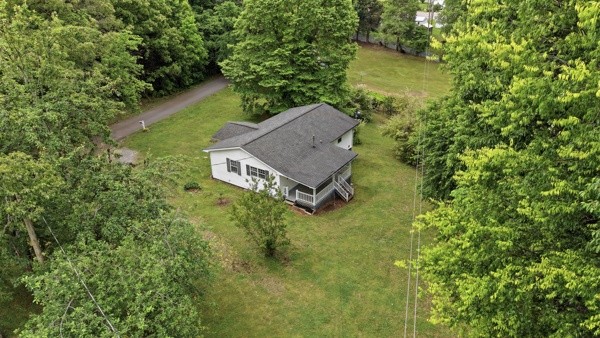 91 Golden Road Lynchburg, TN 37352 - Photo 22 of 24 an aerial view of a house with a yard basket ball court and outdoor seating