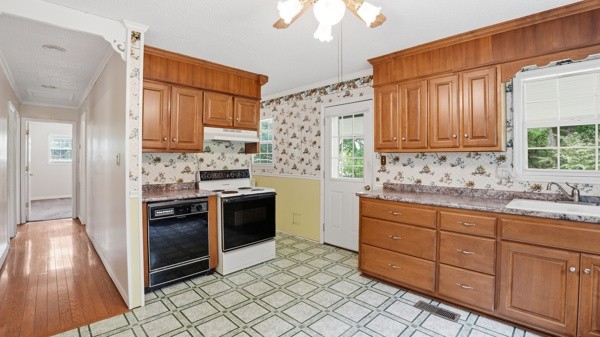 91 Golden Road Lynchburg, TN 37352 - Photo 8 of 24 a kitchen with stainless steel appliances granite countertop a stove a sink and a refrigerator