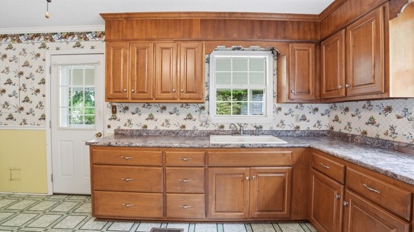 91 Golden Road Lynchburg, TN 37352 - Photo 9 of 24 a kitchen with granite countertop a sink and a window