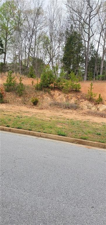1268 Side Step Trace Lawrenceville, GA 30045 - Photo 5 of 5 a view of a yard with a large tree