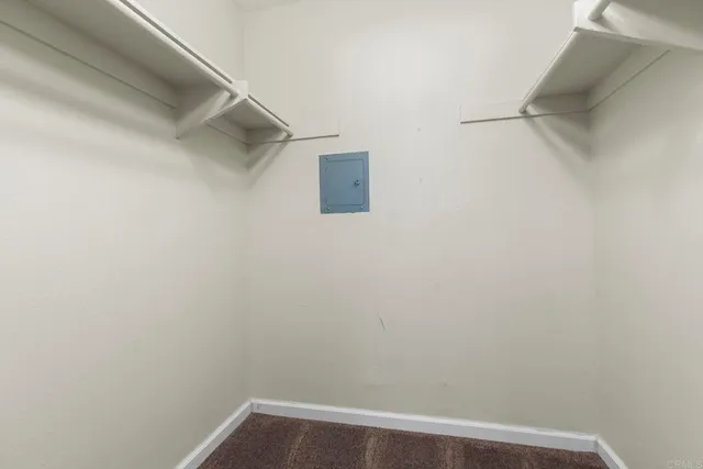 a view of a small space with racks on the wall