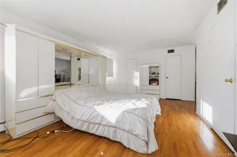 a bed room with a bed and dresser