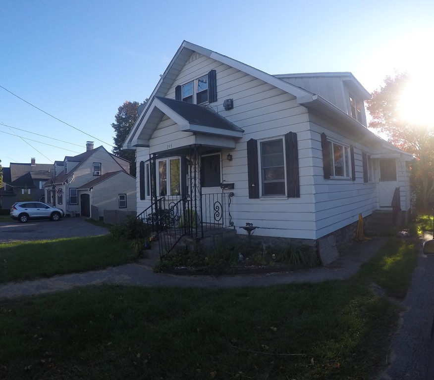 215 Beverly Road Worcester, MA 01605 - Photo 1 of 8 a front view of a house with garden