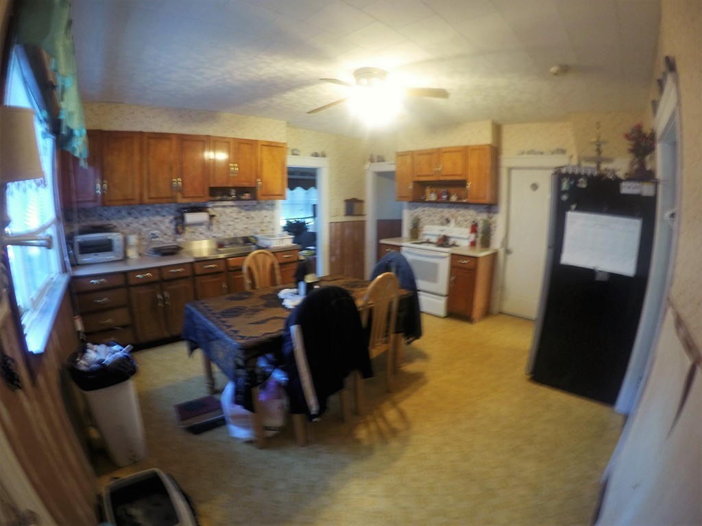 215 Beverly Road Worcester, MA 01605 - Photo 5 of 8 a view of a kitchen with refrigerator and a stove