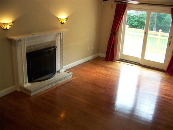 2 B Catherine Road Framingham, MA 01701 - Photo 3 of 30 a view of an empty room with wooden floor and a window