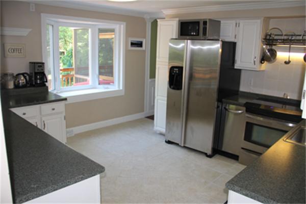 2 B Catherine Road Framingham, MA 01701 - Photo 4 of 30 a kitchen with stainless steel appliances a refrigerator and a stove