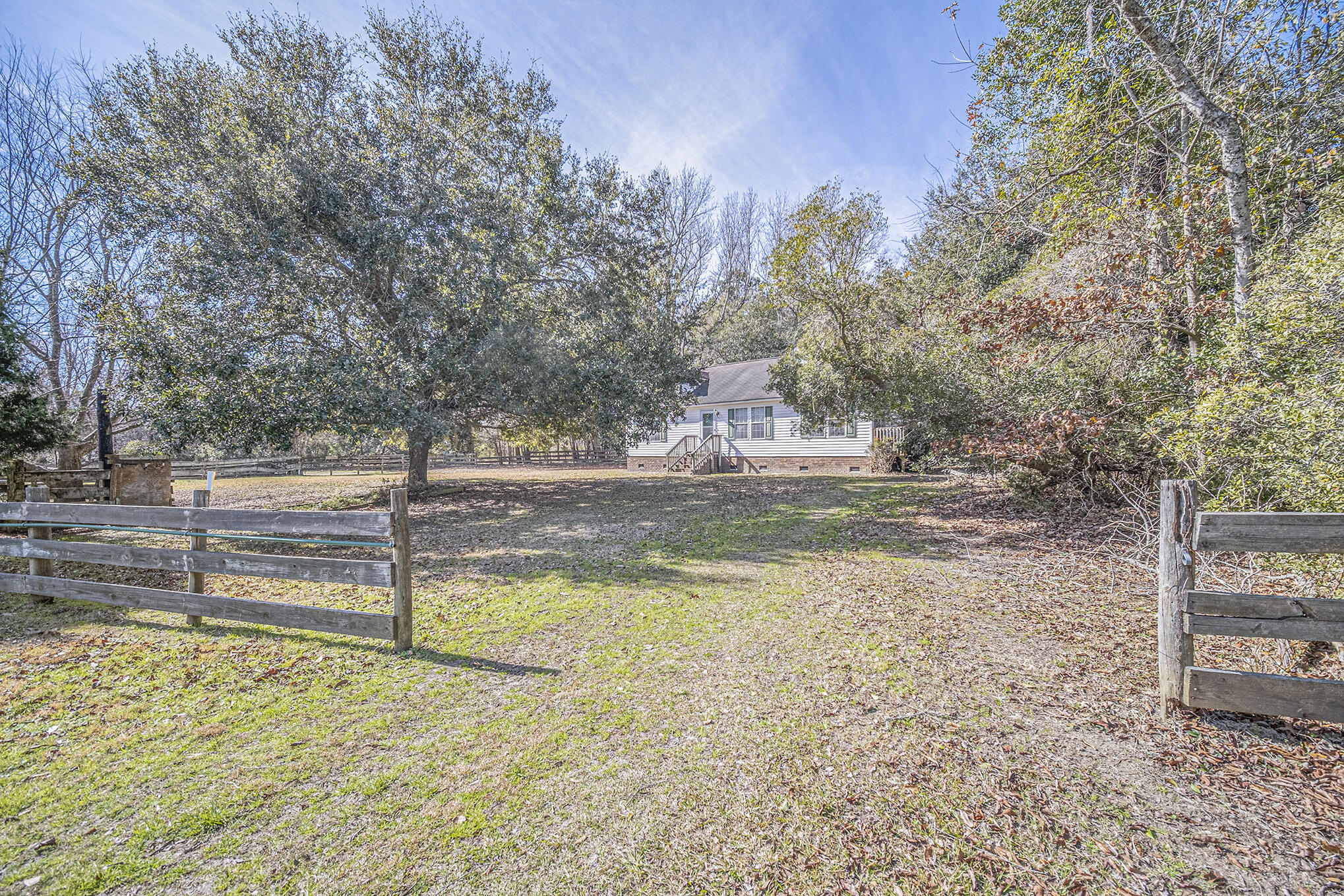 4267 Quigley Road Meggett, SC 29449 - Photo 3 of 37 House Front at Fence