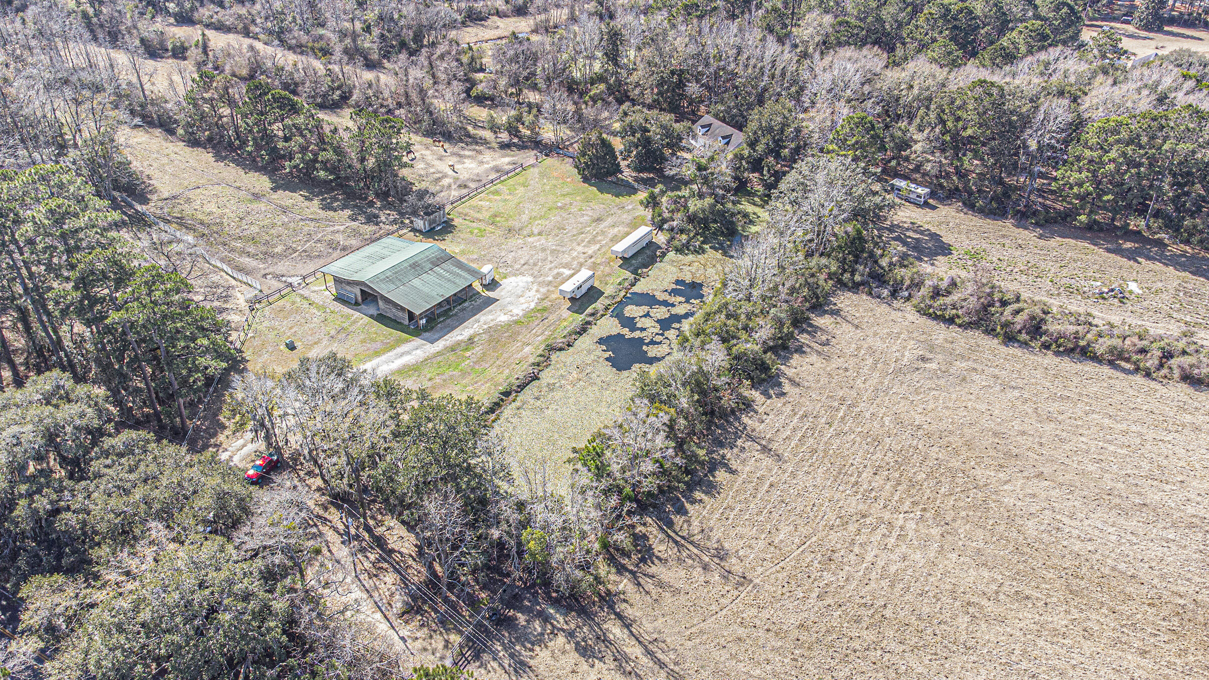 4267 Quigley Road Meggett, SC 29449 - Photo 34 of 37 Aerial 5 Barn House Pond