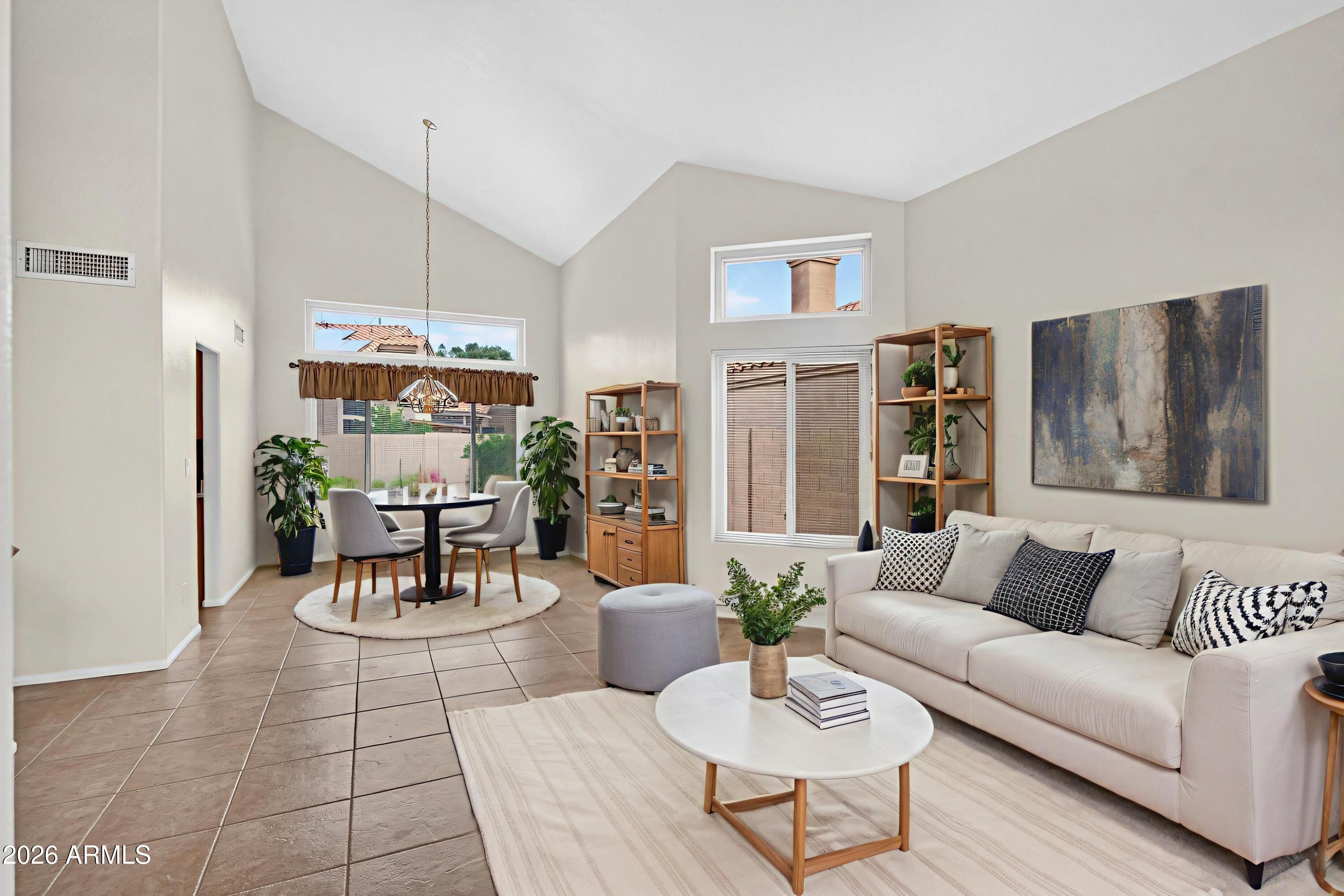 310 East Vaughn Avenue Gilbert, AZ 85234 - Photo 10 of 73 a living room with furniture kitchen view and a chandelier