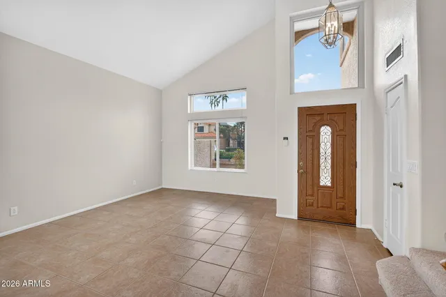 a kitchen with stainless steel appliances granite countertop a refrigerator a stove a sink a oven and a refrigerator