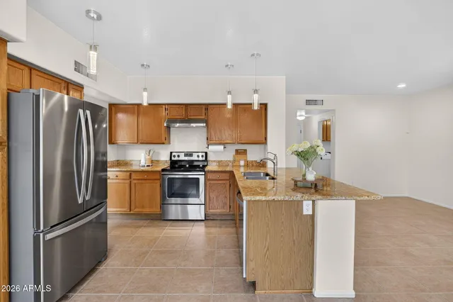 a view of a livingroom with a fireplace and window