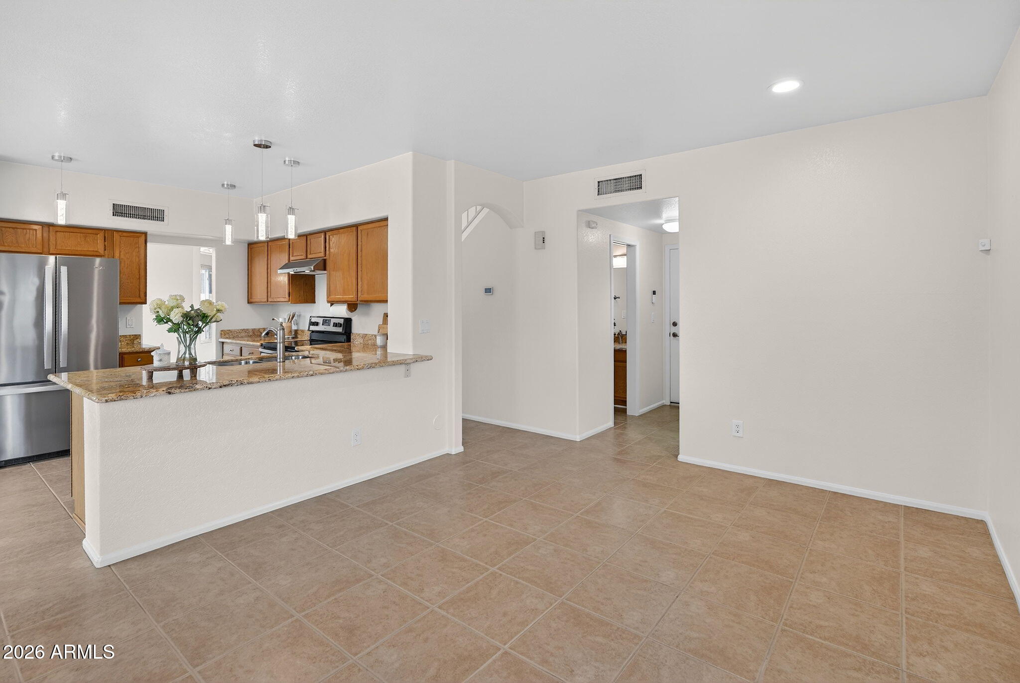 310 East Vaughn Avenue Gilbert, AZ 85234 - Photo 24 of 73 a view of kitchen and refrigerator