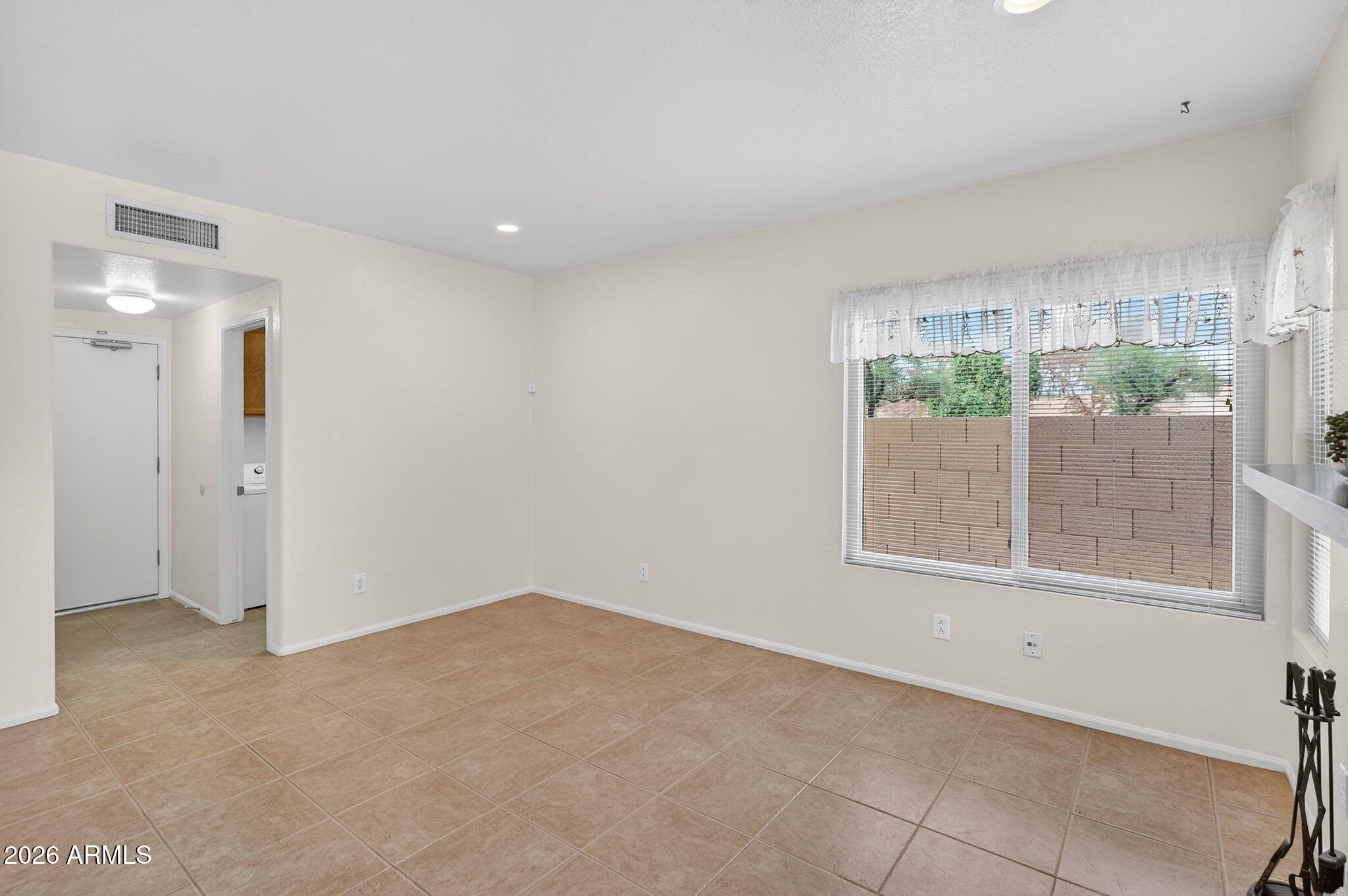 310 East Vaughn Avenue Gilbert, AZ 85234 - Photo 27 of 73 a view of an empty room with a window