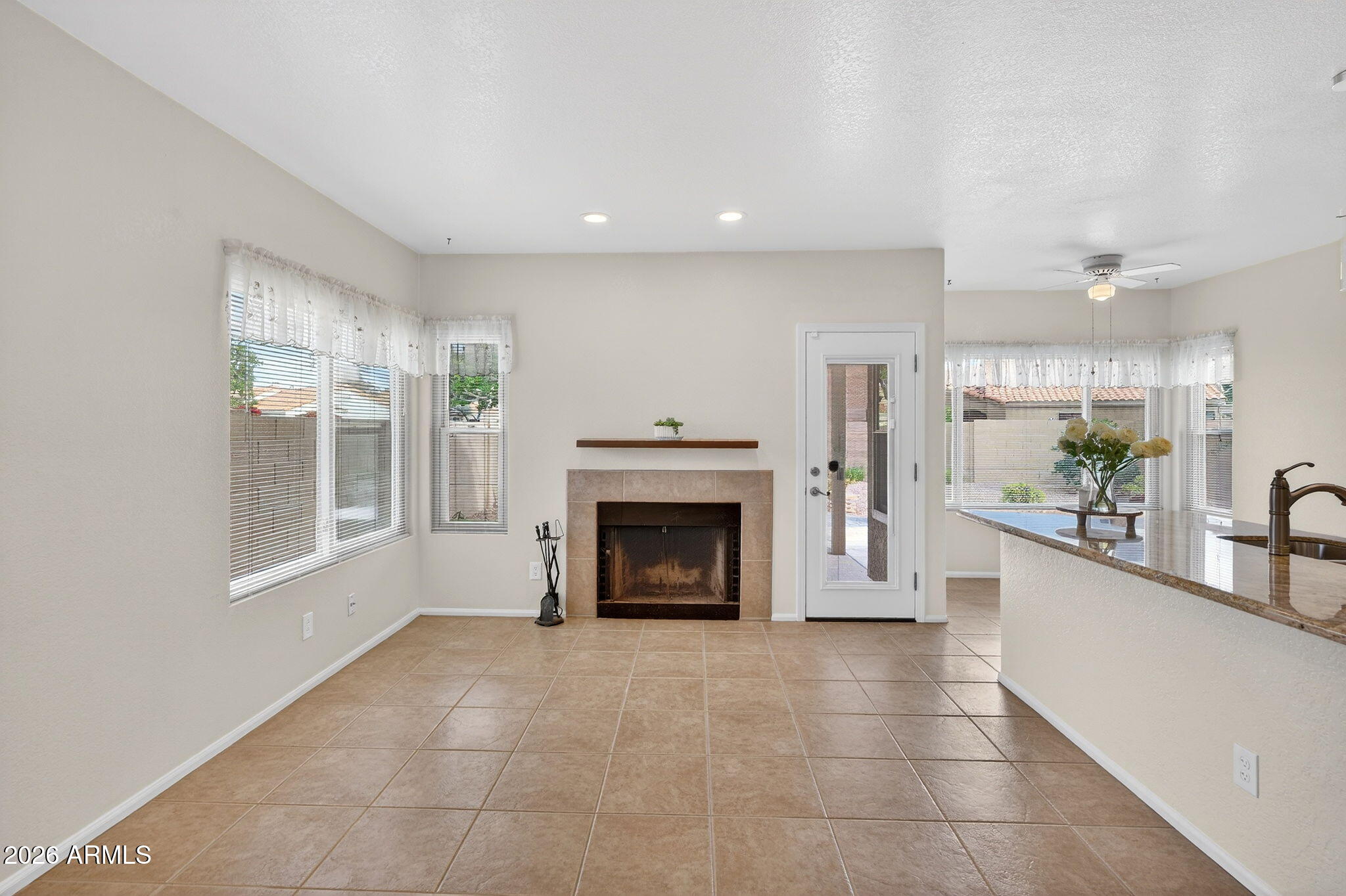 310 East Vaughn Avenue Gilbert, AZ 85234 - Photo 28 of 73 a view of a livingroom with a fireplace and window