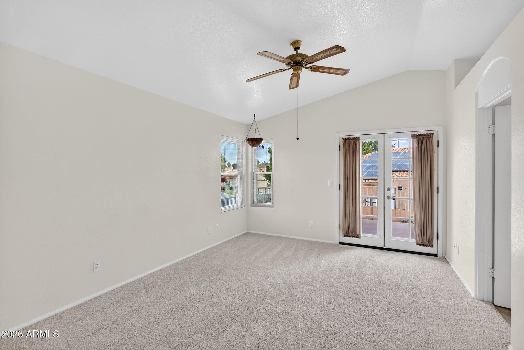 310 East Vaughn Avenue Gilbert, AZ 85234 - Photo 32 of 73 a view of a room with window and ceiling fan